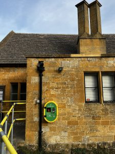 Defibrillator box attached on the side of the Old School in Bourton on the Hill