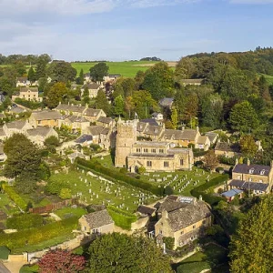 Aerial view of Bourton on the Hill, with a focus on St Lawrence Church.